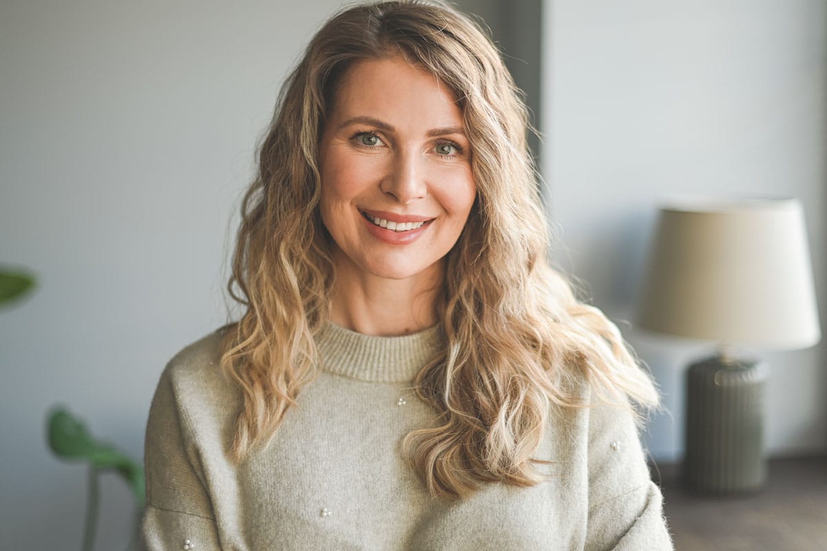 Beautiful woman smiling from results of labiaplasty in New Jersey